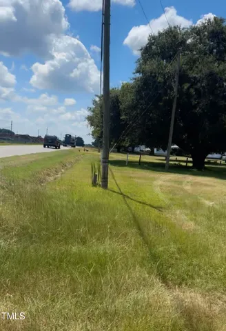 a view of a swimming pool with an outdoor space and seating area
