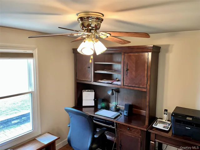 a workspace with furniture and chandelier