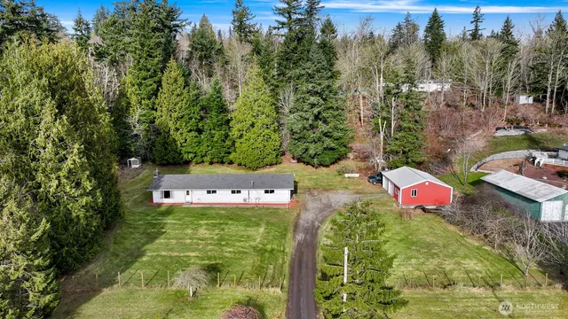 a view of a house with a backyard