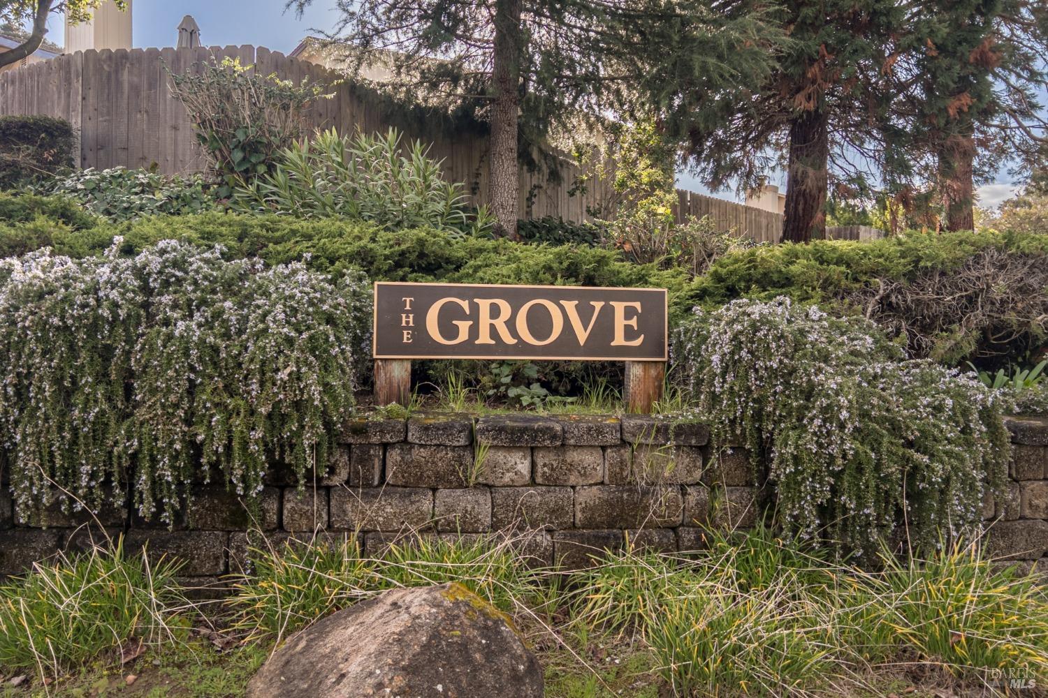 1279 Grove Circle Benicia, CA 94510 - Photo 1 of 1 a sign that is sitting on a brick wall