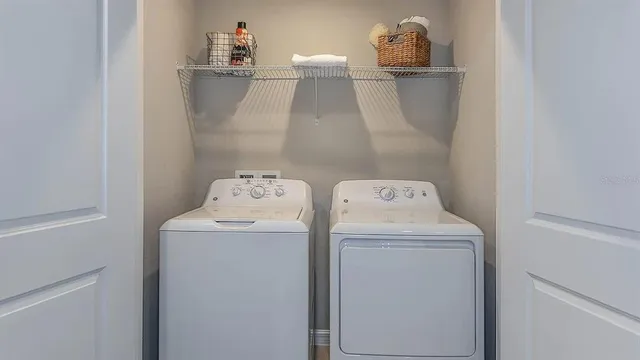 a utility room with dryer and washer