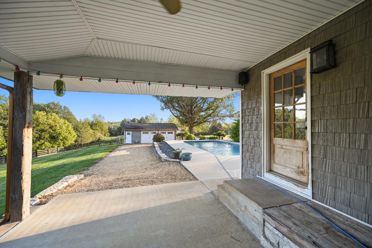 9463 Stoops Road Dillsboro, IN 47018 - Photo 30 of 99 Step from the mudroom onto the covered patio. Head to the pool, relax in the shade or fire up the grill...