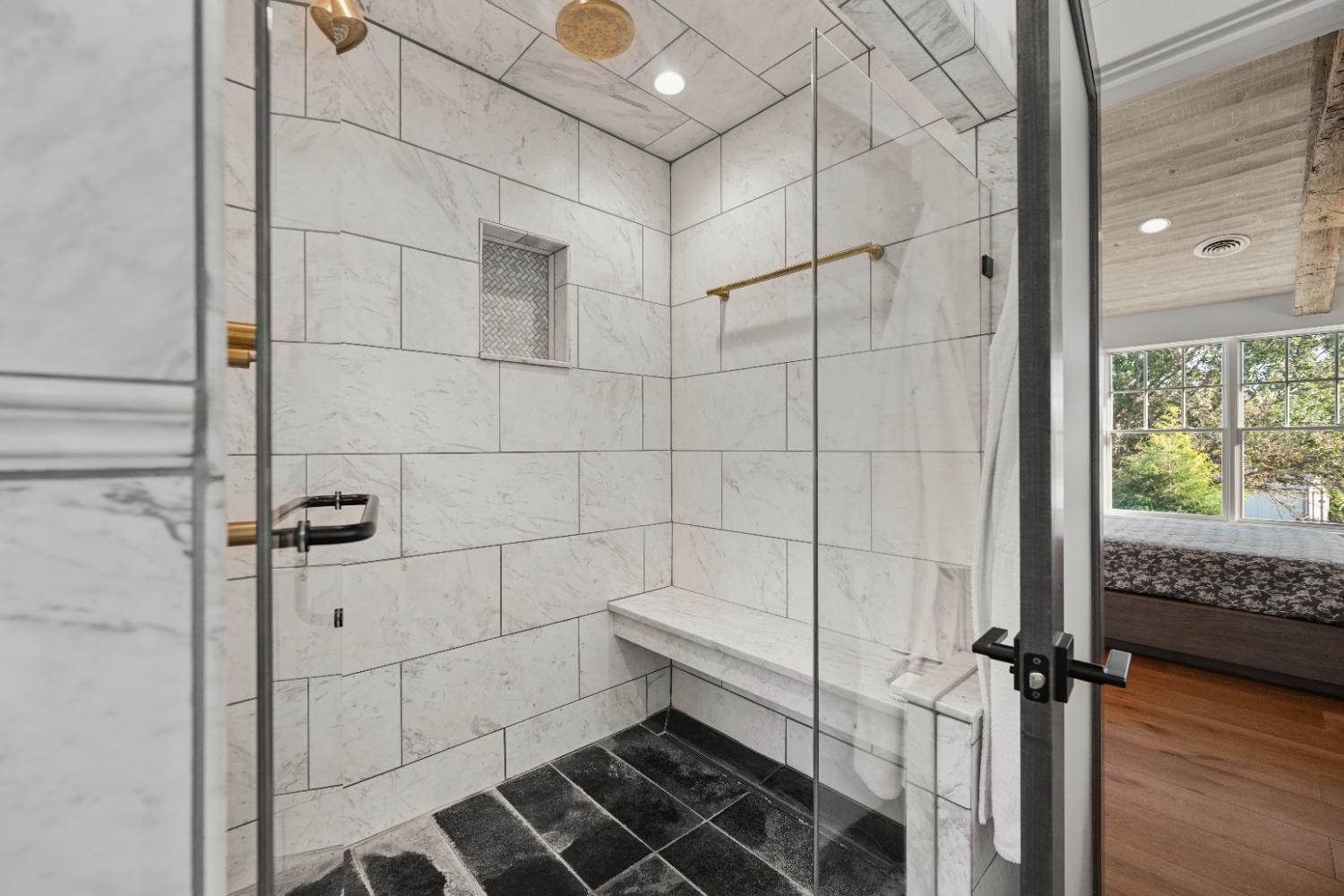 9463 Stoops Road Dillsboro, IN 47018 - Photo 42 of 99 A spacious double tile shower, complete with multiple showerheads and built-in marble bench, rounds out this wonderful bath.