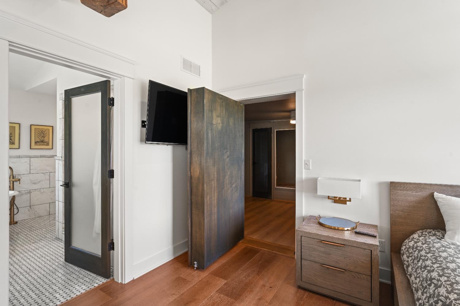 9463 Stoops Road Dillsboro, IN 47018 - Photo 47 of 99 The bookcase is actually a hidden door, which opens directly into Bedroom 4...great access for a nursery or young children, or for a private dressing room or office if a fourth bedroom isn't needed. The fourth bedroom can also be accessed from the top of the staircase from the Butler's Pantry.