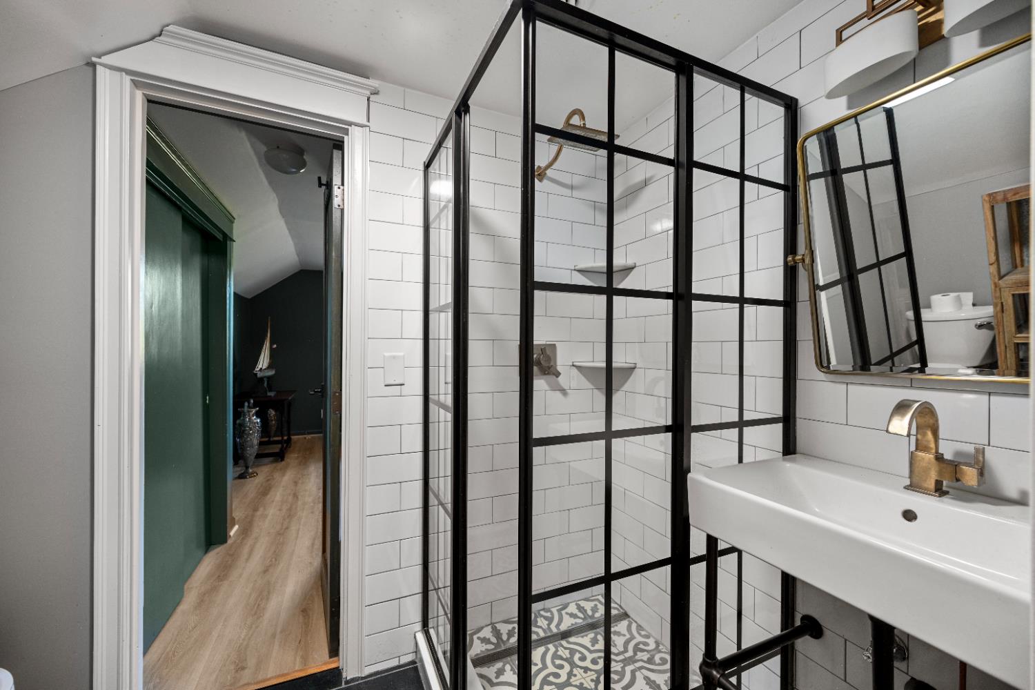 9463 Stoops Road Dillsboro, IN 47018 - Photo 49 of 99 The Jack & Jill bath between Bedrooms 3 & 4 features a glass & tile shower, single sink and toilet.