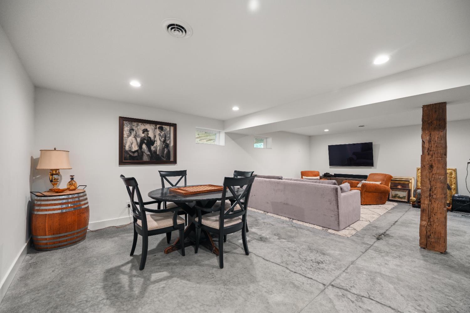 9463 Stoops Road Dillsboro, IN 47018 - Photo 54 of 99 The majority of the basement under the 2017 addition is finished into a large open Family Room with polished concrete floors.