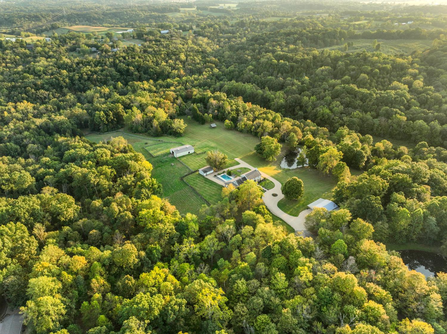 9463 Stoops Road Dillsboro, IN 47018 - Photo 72 of 99 Aerial view from the front towards the rear of the property.
