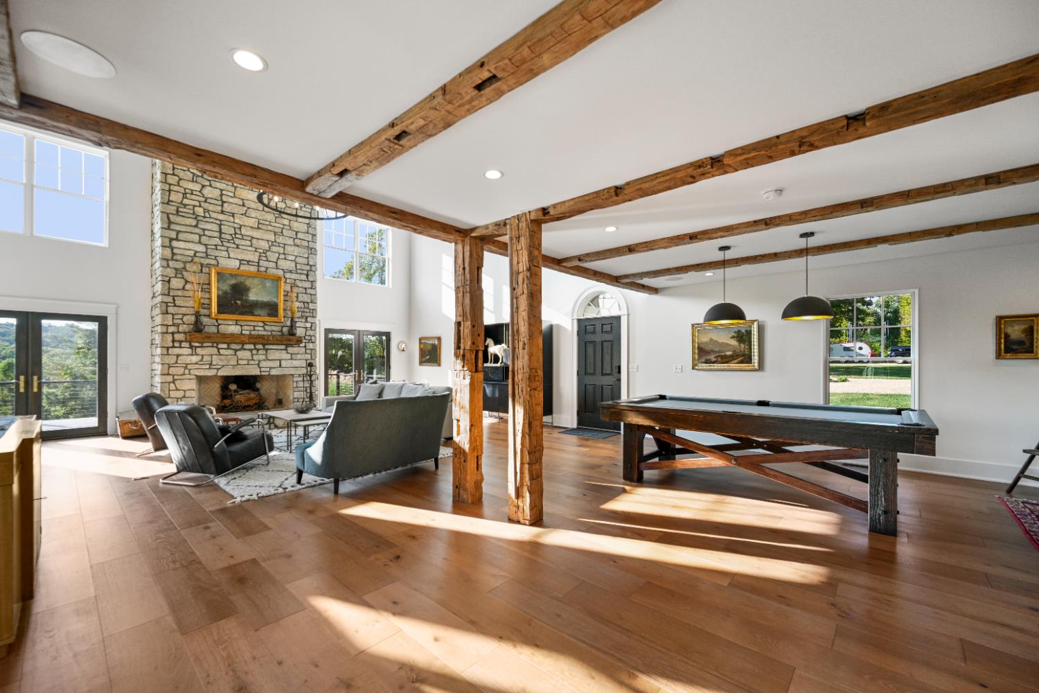 9463 Stoops Road Dillsboro, IN 47018 - Photo 8 of 99 Off the conversation section of the Great Room, more natural posts & beams define two additional spaces, one dedicated to the family pool table.