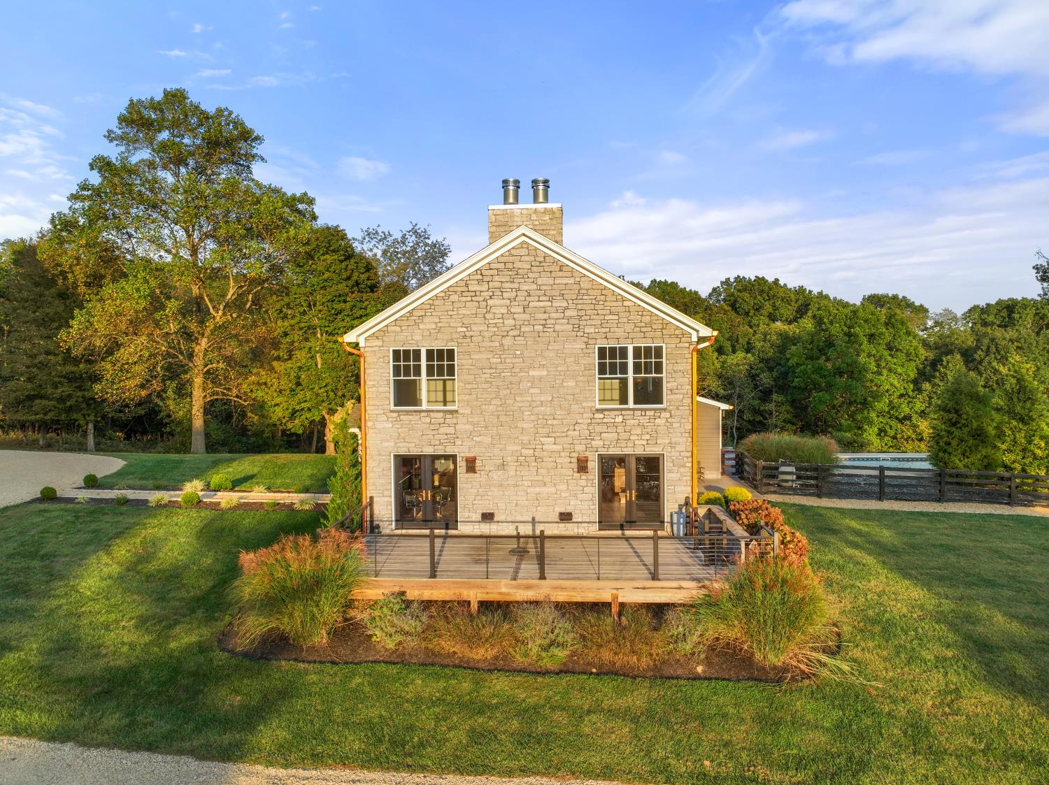 9463 Stoops Road Dillsboro, IN 47018 - Photo 83 of 99 The side deck offers views of the front & rear woods as well as the pond.