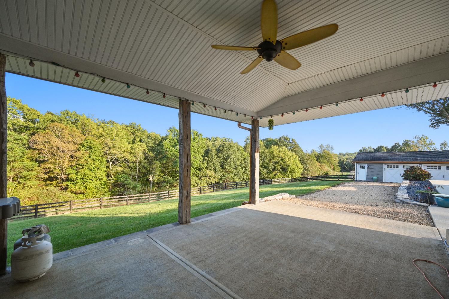 9463 Stoops Road Dillsboro, IN 47018 - Photo 93 of 99 Covered porch off the mudroom is convenient for grilling in any weather. Enjoy views of pasture & woods from here.