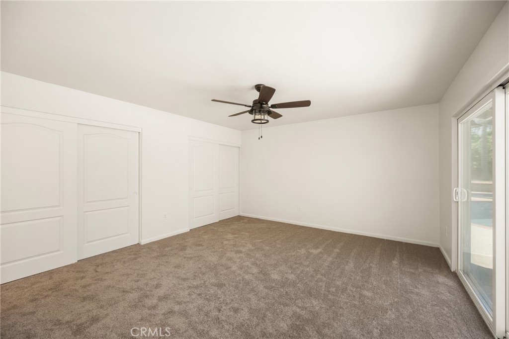 16481 Valle Vista Way Riverside, CA 92506 - Photo 30 of 73 a view of a room with a ceiling fan and window