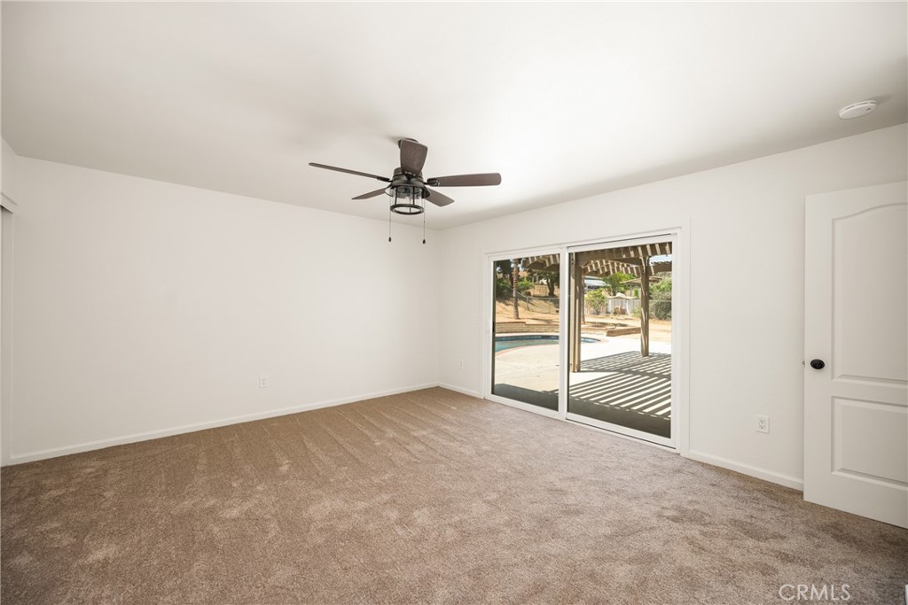 16481 Valle Vista Way Riverside, CA 92506 - Photo 31 of 73 a view of a room with a ceiling fan