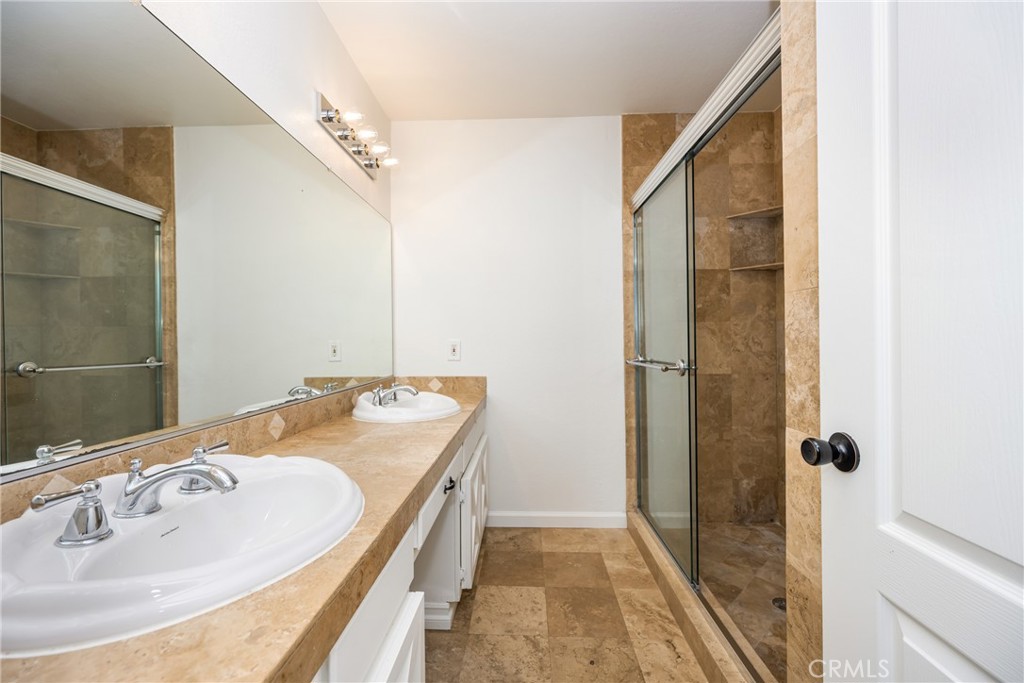16481 Valle Vista Way Riverside, CA 92506 - Photo 34 of 73 a bathroom with a sink and a mirror