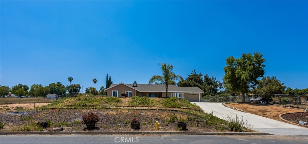 16481 Valle Vista Way Riverside, CA 92506 - Photo 60 of 73 a front view of a house with a yard