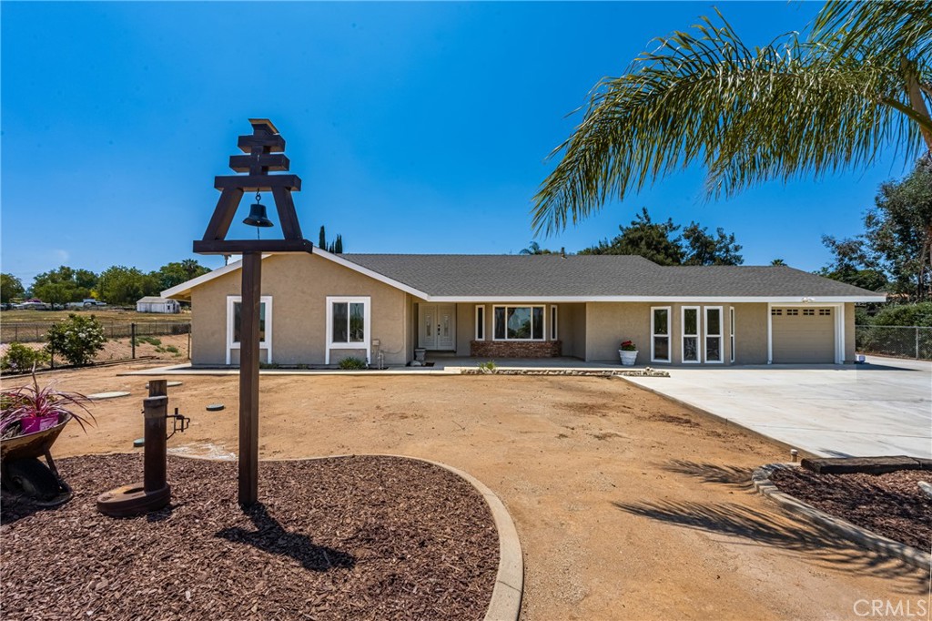 16481 Valle Vista Way Riverside, CA 92506 - Photo 72 of 73 a front view of a house with a yard and potted plants