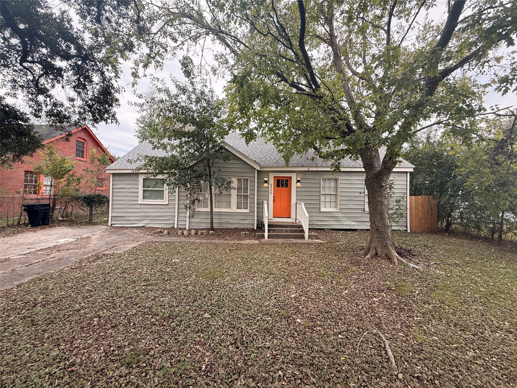 6633 Burkett Street Houston, TX 77021 - Photo 2 of 13 a house with trees in the background
