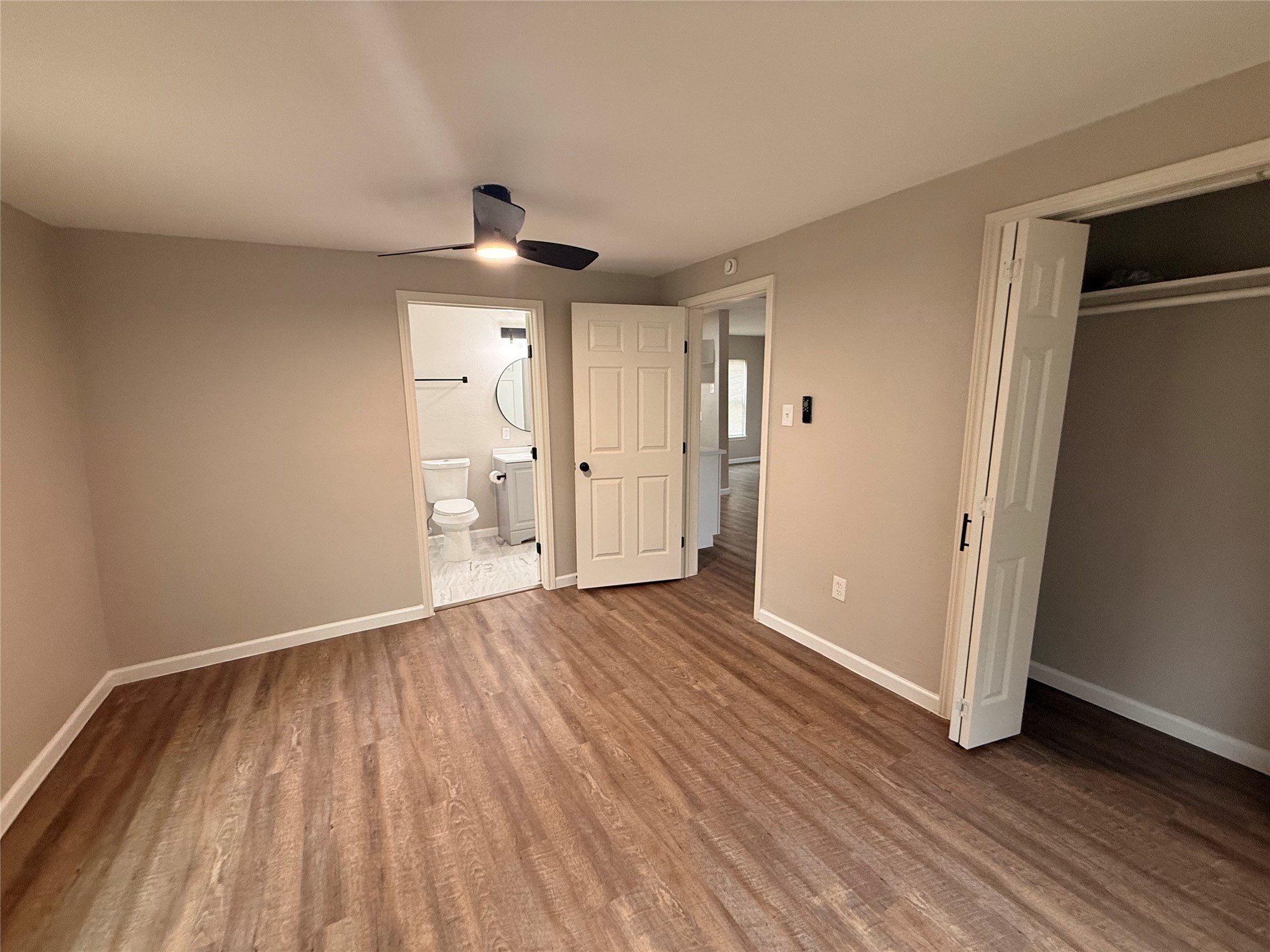 6633 Burkett Street Houston, TX 77021 - Photo 7 of 13 a view of an empty room with wooden floor cabinet and a window
