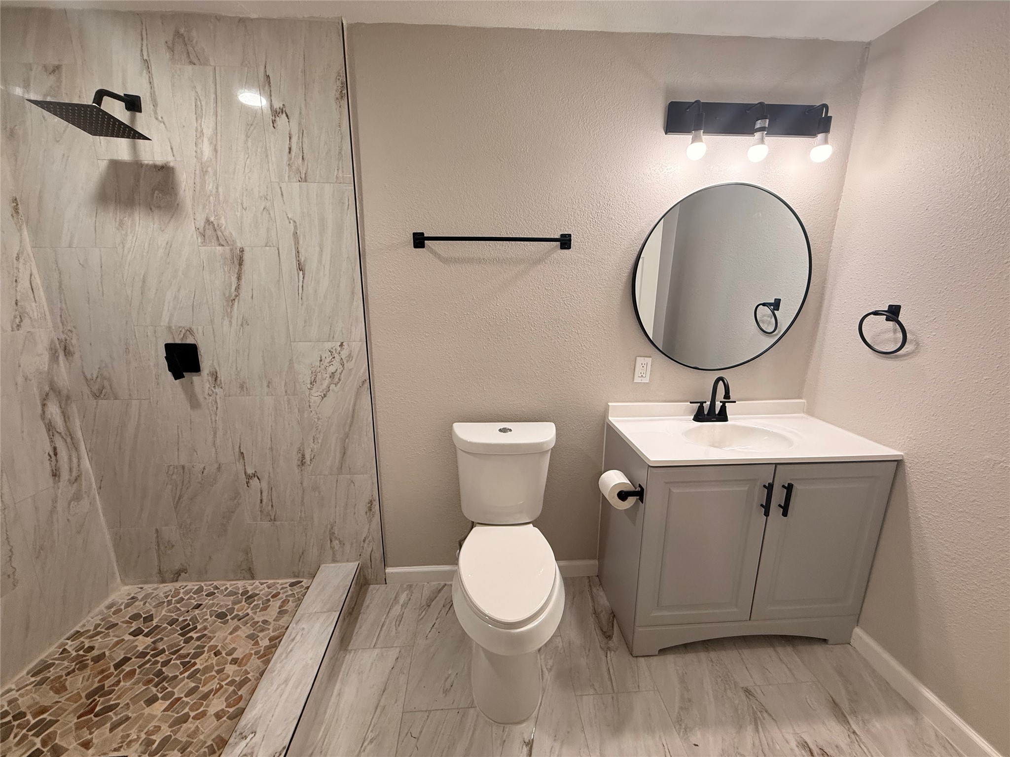 6633 Burkett Street Houston, TX 77021 - Photo 9 of 13 a bathroom with a toilet sink and mirror