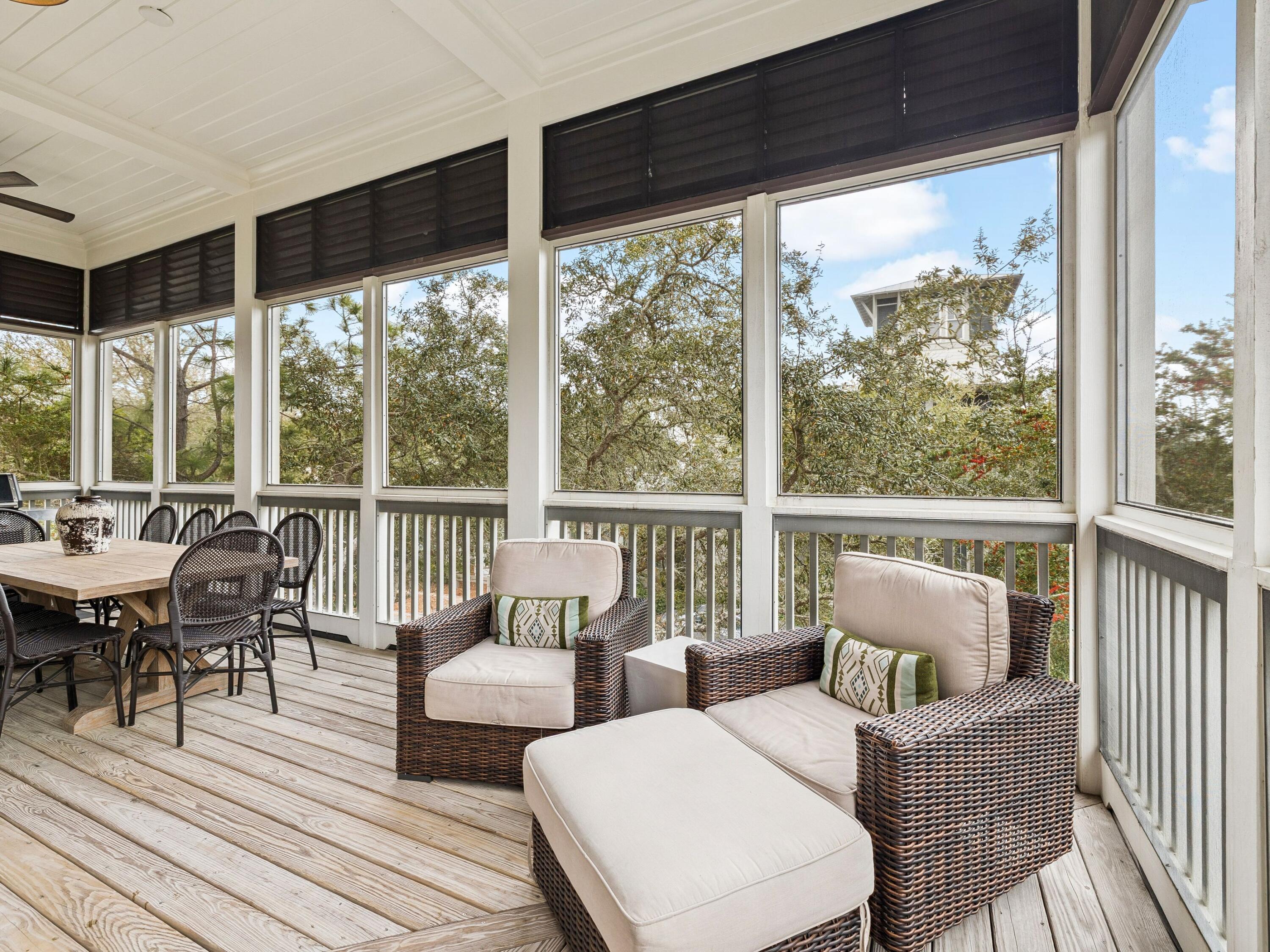 51 Mystic Cobalt Street Santa Rosa Beach, FL 32459 - Photo 22 of 46 a balcony with furniture and wooden floor