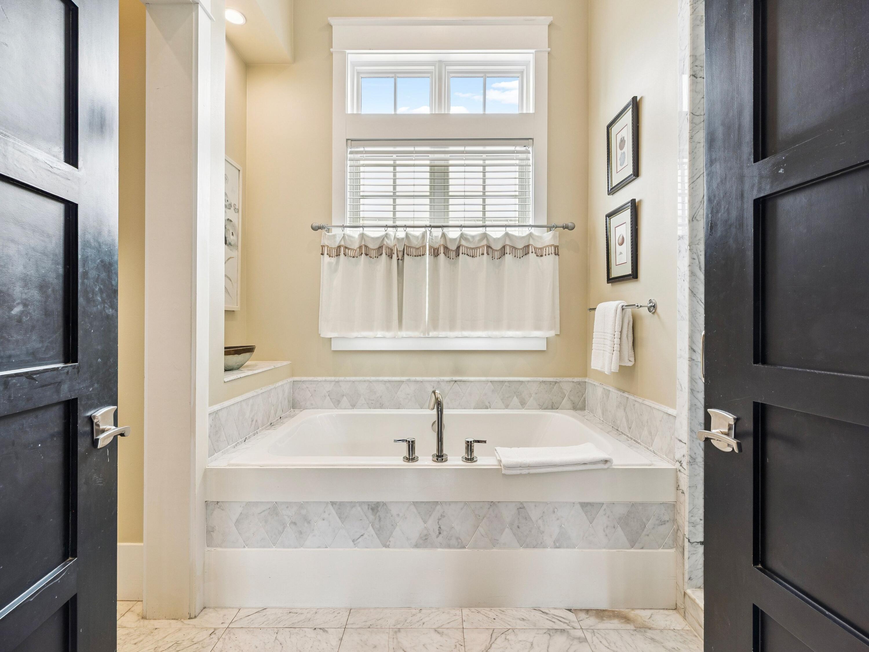 51 Mystic Cobalt Street Santa Rosa Beach, FL 32459 - Photo 24 of 46 a bath tub sitting next to a window