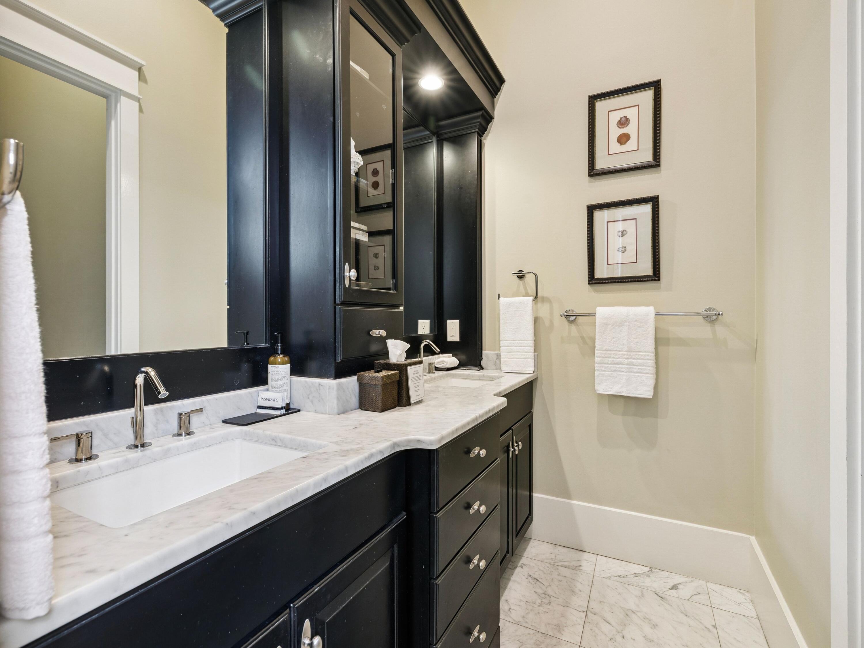 51 Mystic Cobalt Street Santa Rosa Beach, FL 32459 - Photo 25 of 46 a bathroom with a sink and a mirror