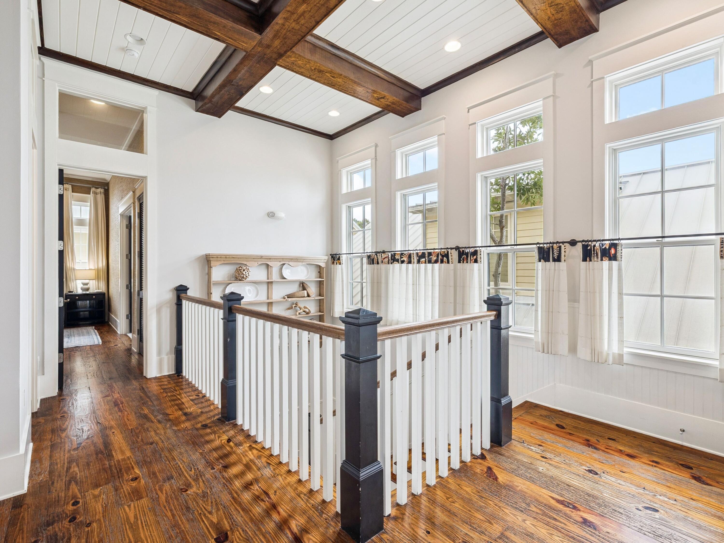 51 Mystic Cobalt Street Santa Rosa Beach, FL 32459 - Photo 27 of 46 a view of a hallway with wooden floor and windows