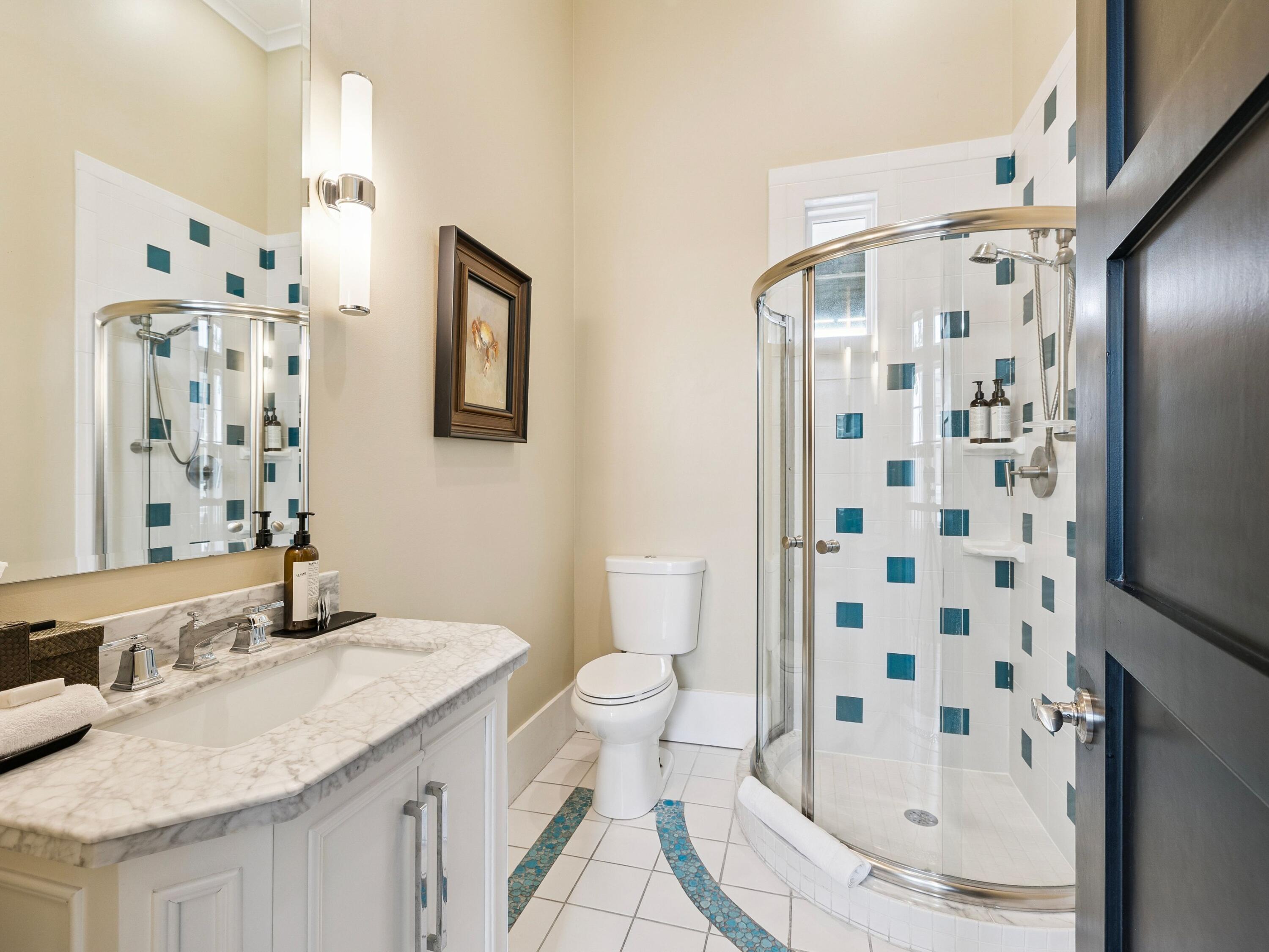51 Mystic Cobalt Street Santa Rosa Beach, FL 32459 - Photo 28 of 46 a bathroom with a granite countertop sink a toilet and shower