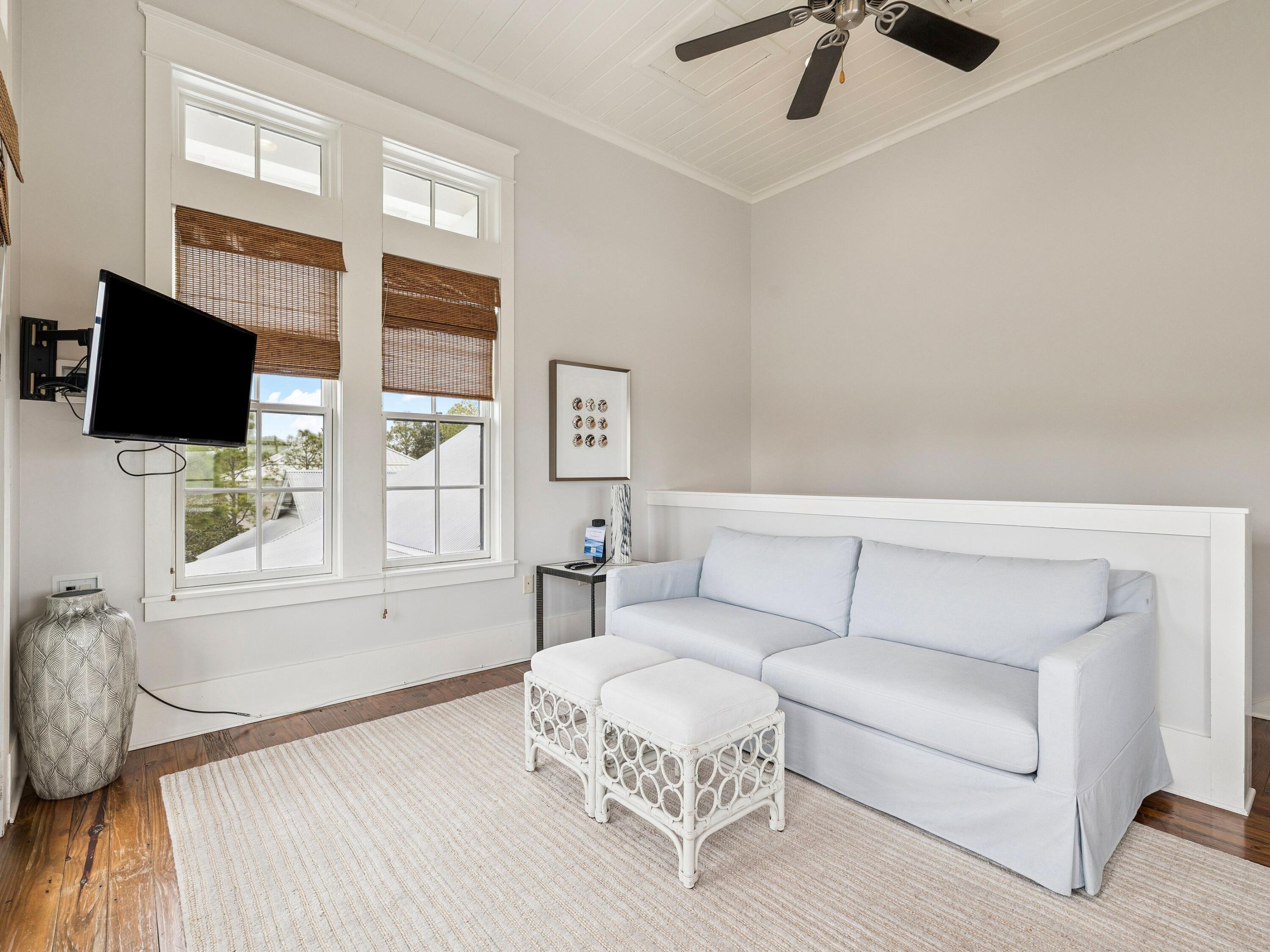 51 Mystic Cobalt Street Santa Rosa Beach, FL 32459 - Photo 29 of 46 a living room with furniture and a flat screen tv