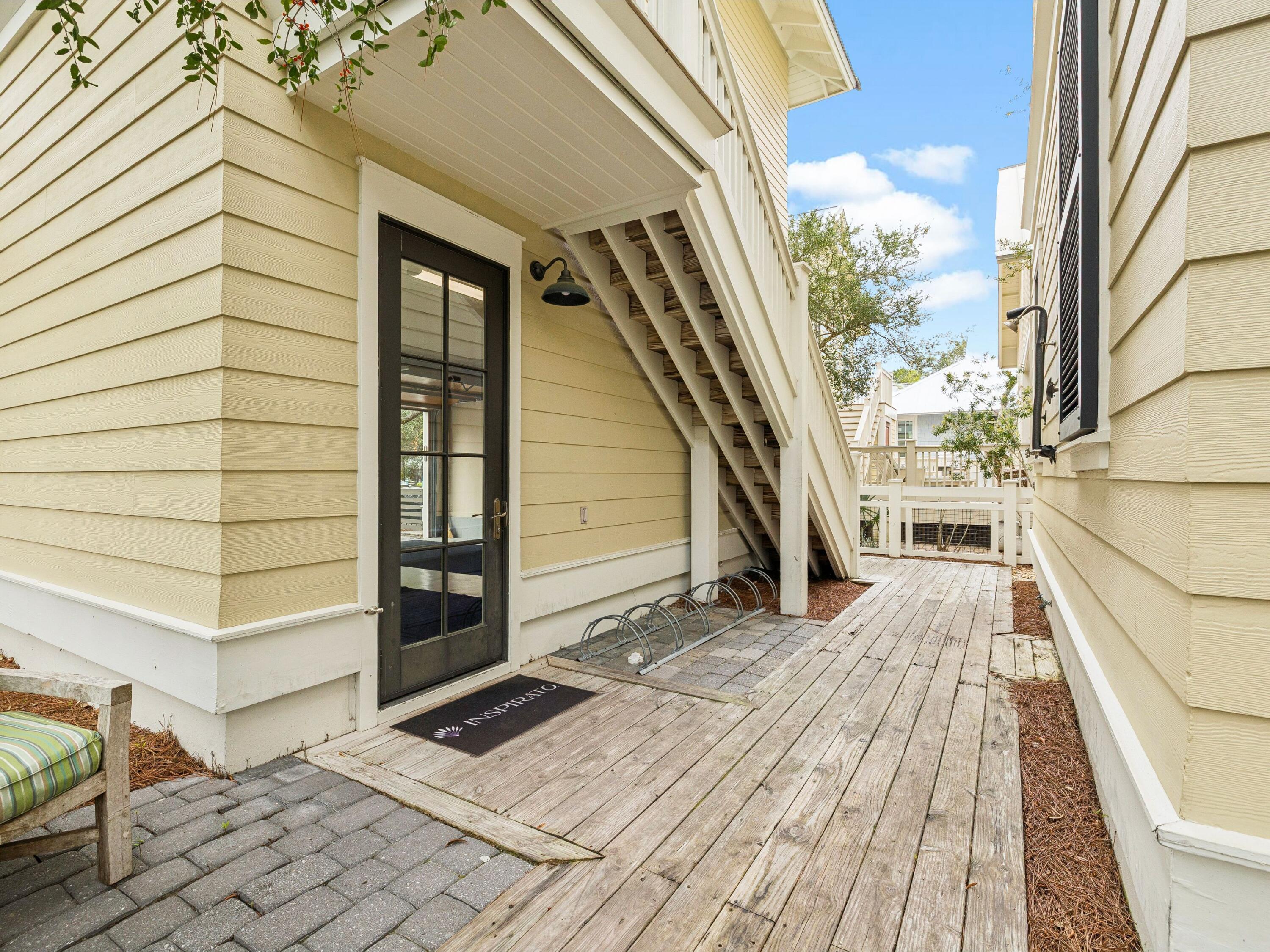 51 Mystic Cobalt Street Santa Rosa Beach, FL 32459 - Photo 33 of 46 a view of a balcony with wooden floor and fence