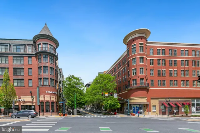 a man standing next to a building