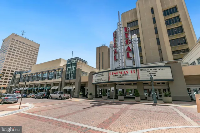 a view of a patio with table and chairs with an umbrella