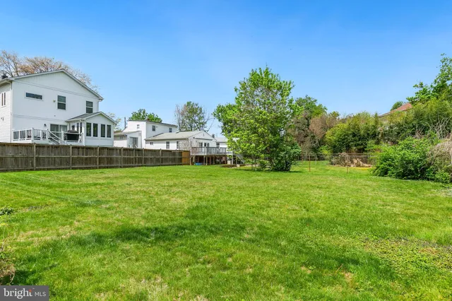a front view of house with yard and trees