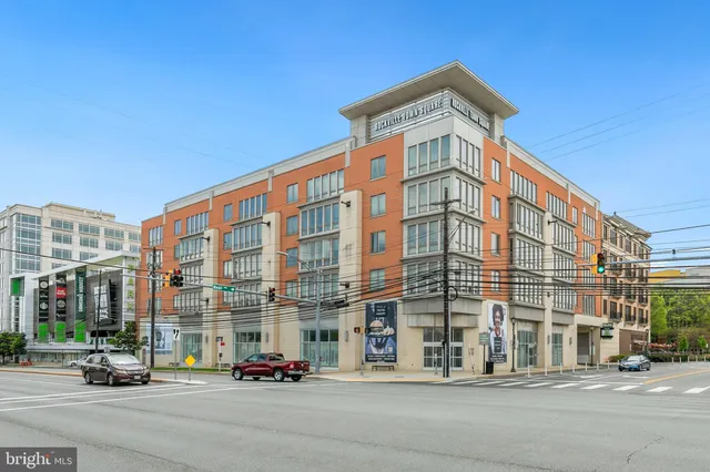 a city street lined with buildings and trees