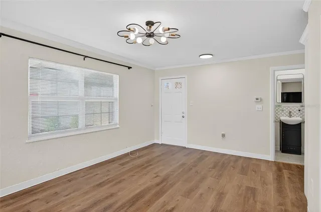 a view of an empty room with a window