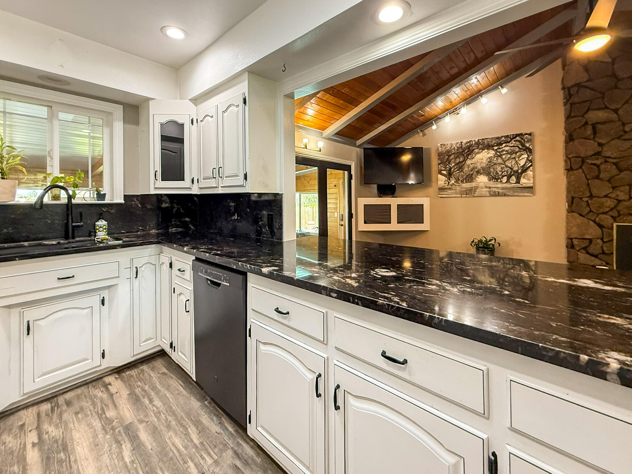 8641 Redbank Road Redding, CA 96001 - Photo 12 of 59 a kitchen with granite countertop stainless steel appliances a sink window and cabinets