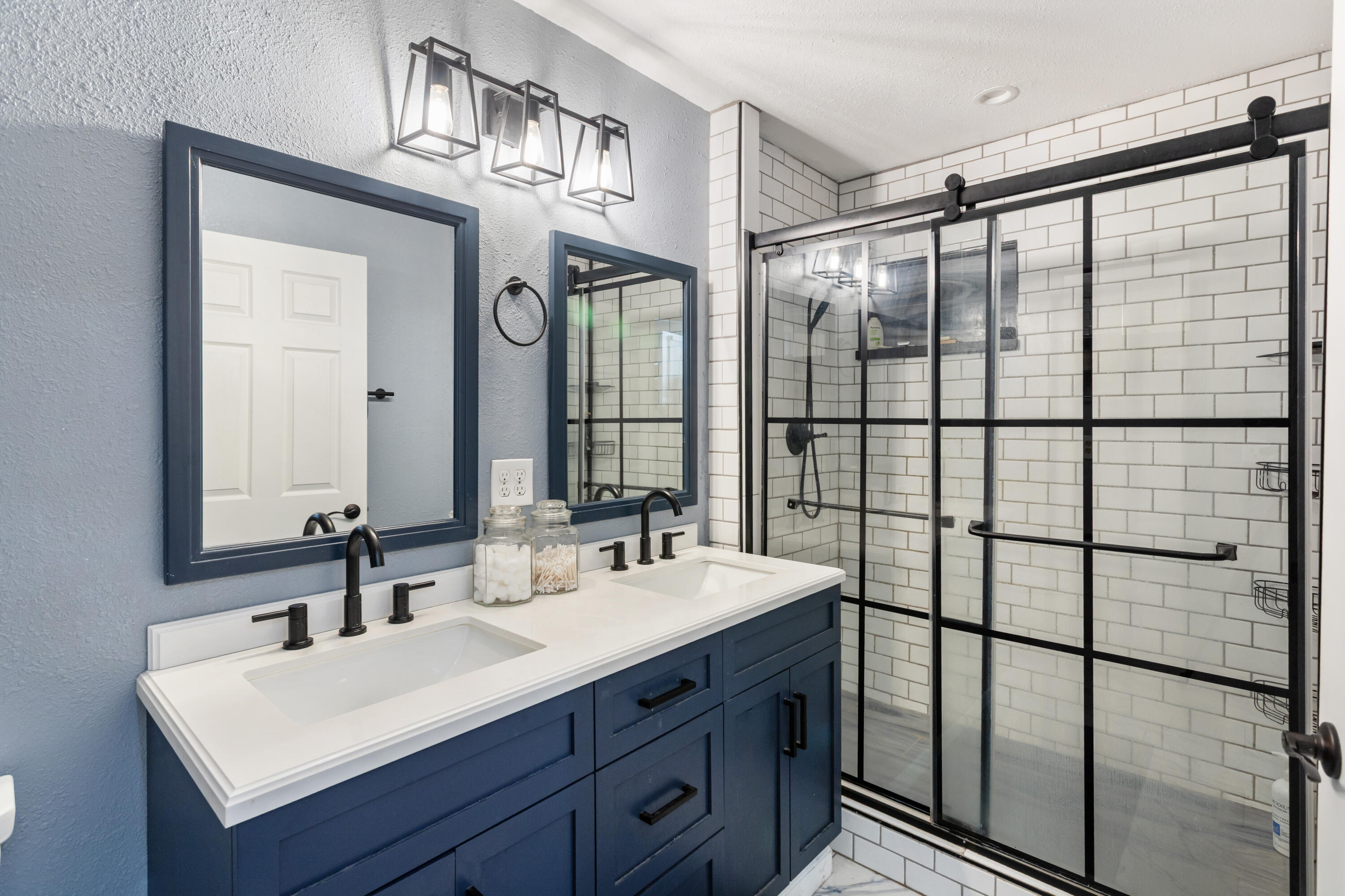 8641 Redbank Road Redding, CA 96001 - Photo 26 of 59 a bathroom with a double vanity sink and mirror