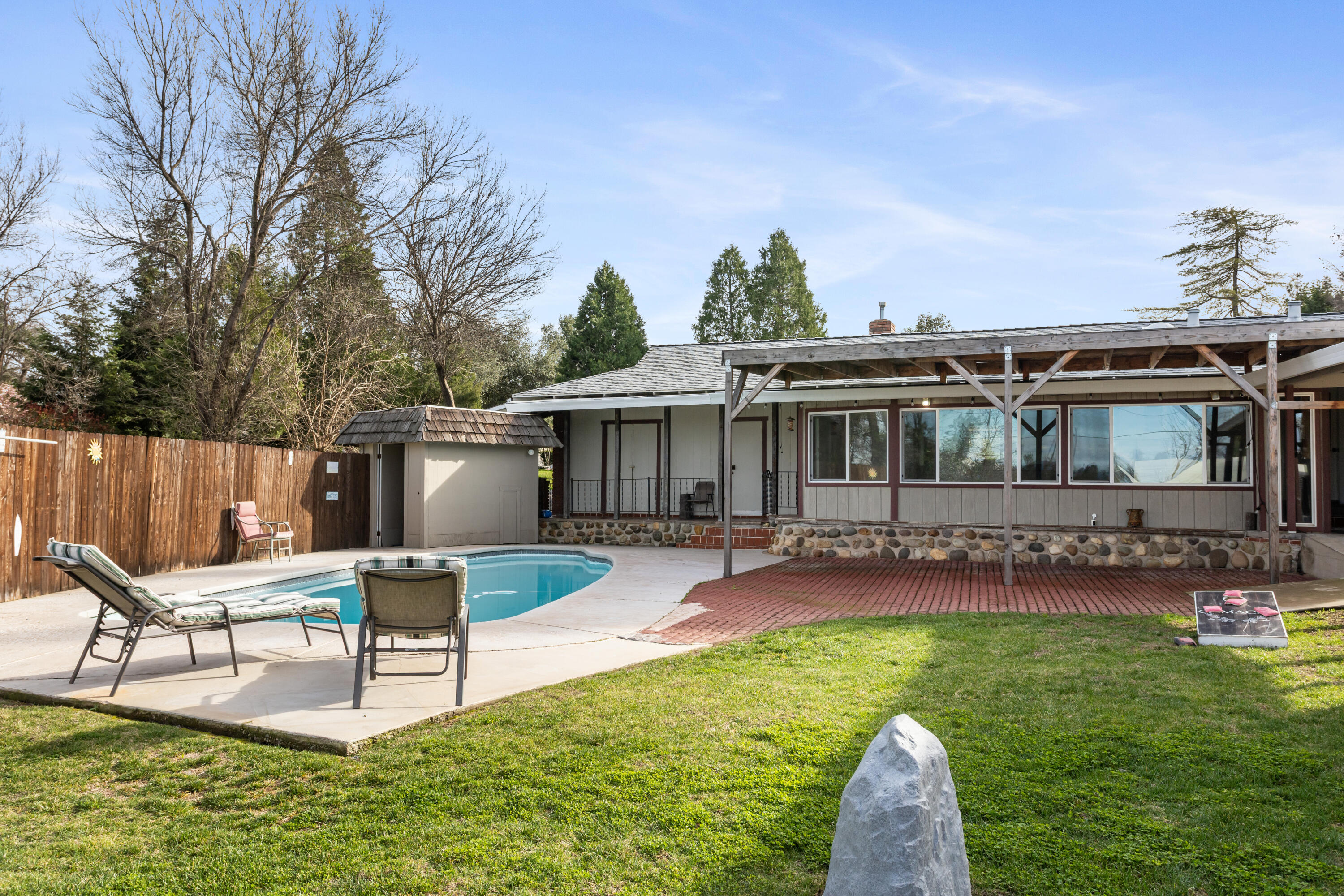 8641 Redbank Road Redding, CA 96001 - Photo 35 of 59 a view of a house with a yard and sitting area