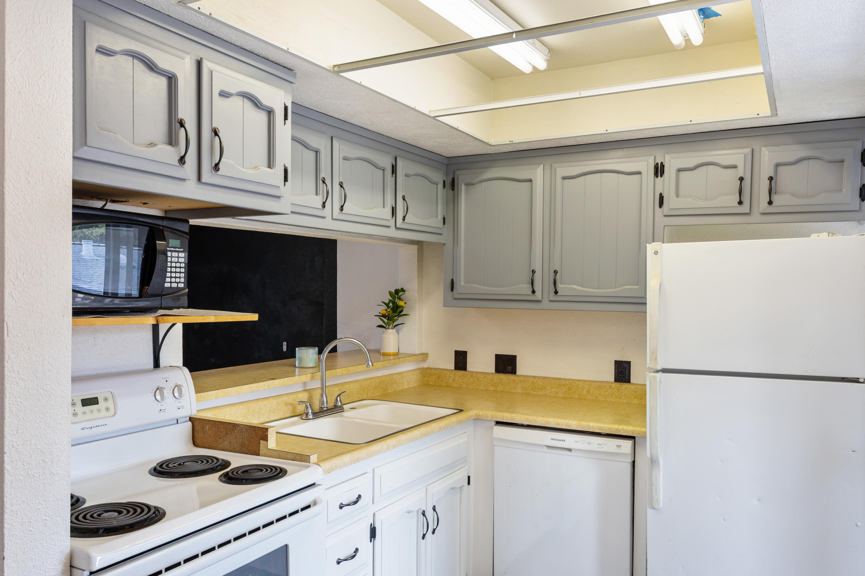 8641 Redbank Road Redding, CA 96001 - Photo 46 of 59 a kitchen with stainless steel appliances granite countertop a sink and cabinets