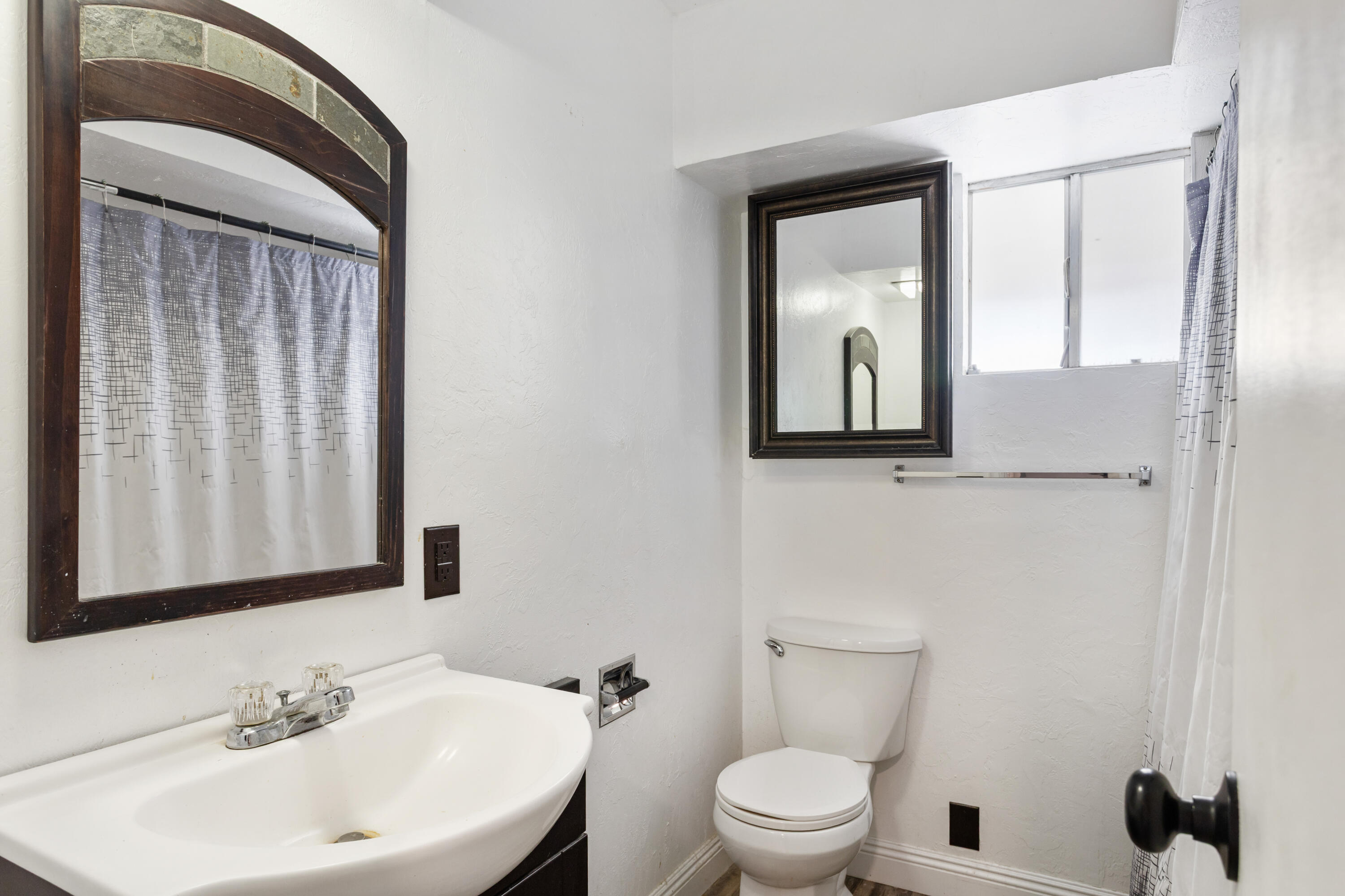 8641 Redbank Road Redding, CA 96001 - Photo 47 of 59 a bathroom with a toilet a sink and mirror