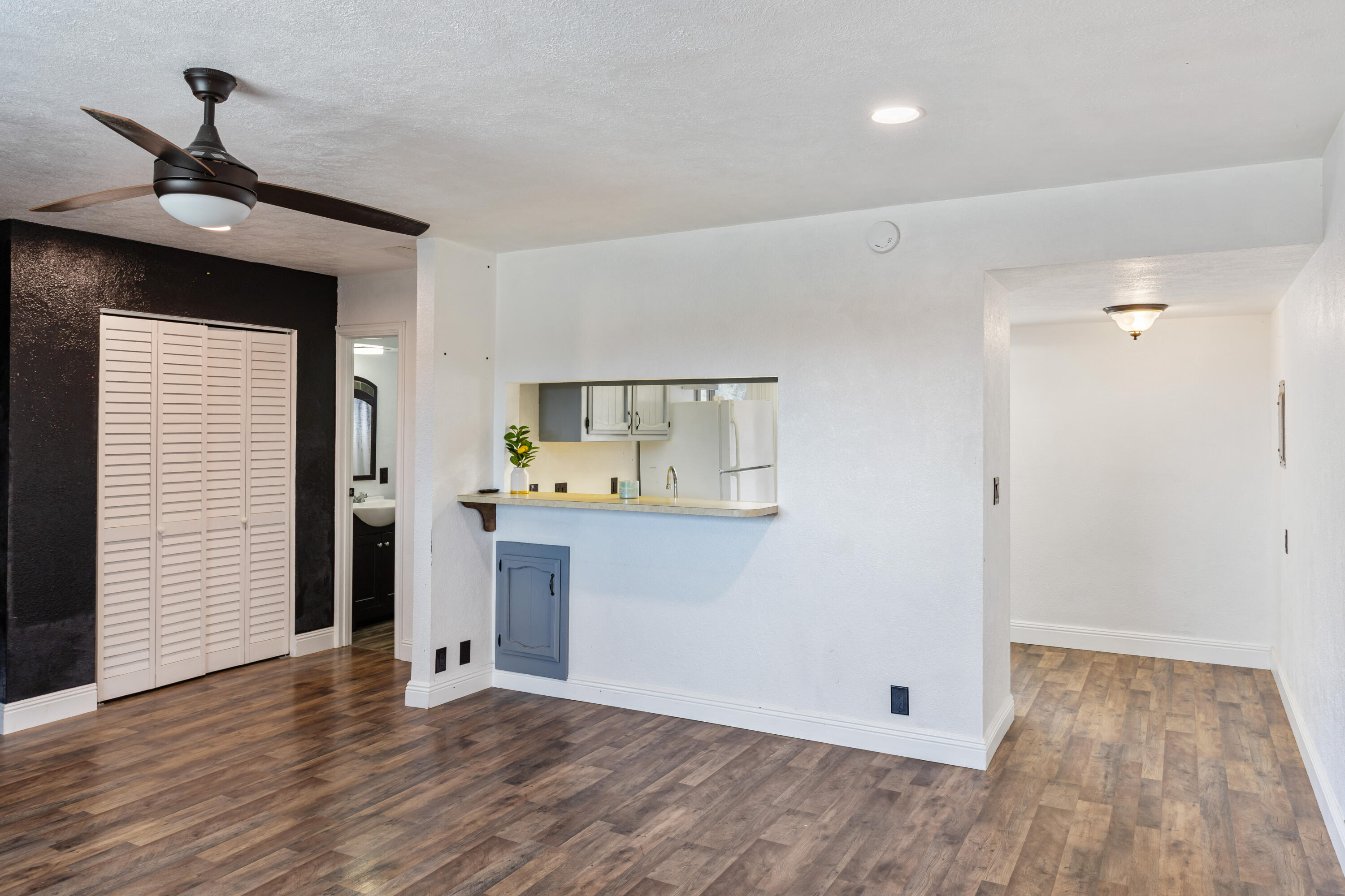 8641 Redbank Road Redding, CA 96001 - Photo 50 of 59 a view of an empty room with wooden floor and a window