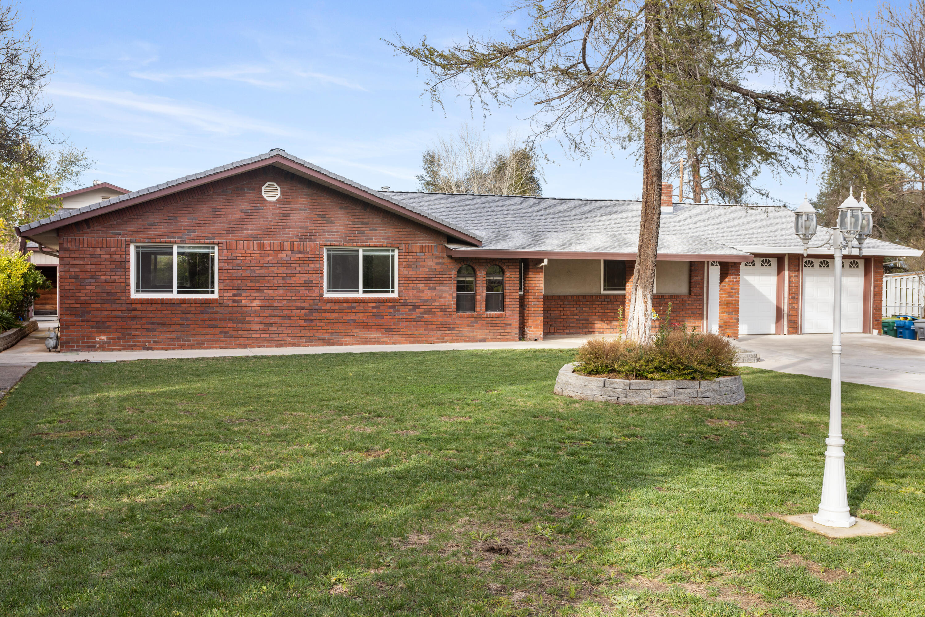 8641 Redbank Road Redding, CA 96001 - Photo 54 of 59 a front view of a house with a yard