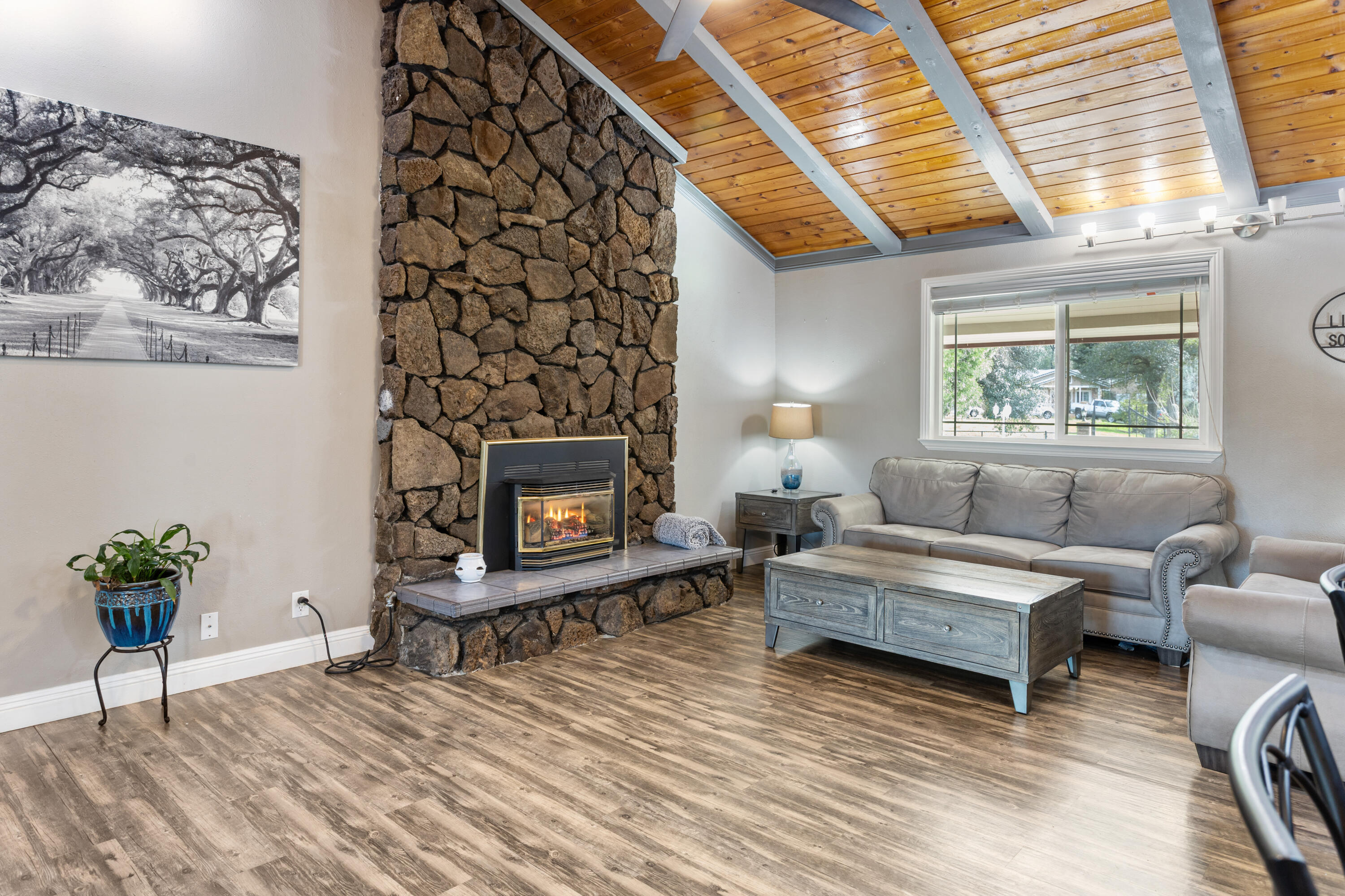 8641 Redbank Road Redding, CA 96001 - Photo 7 of 59 a living room with furniture and a fireplace