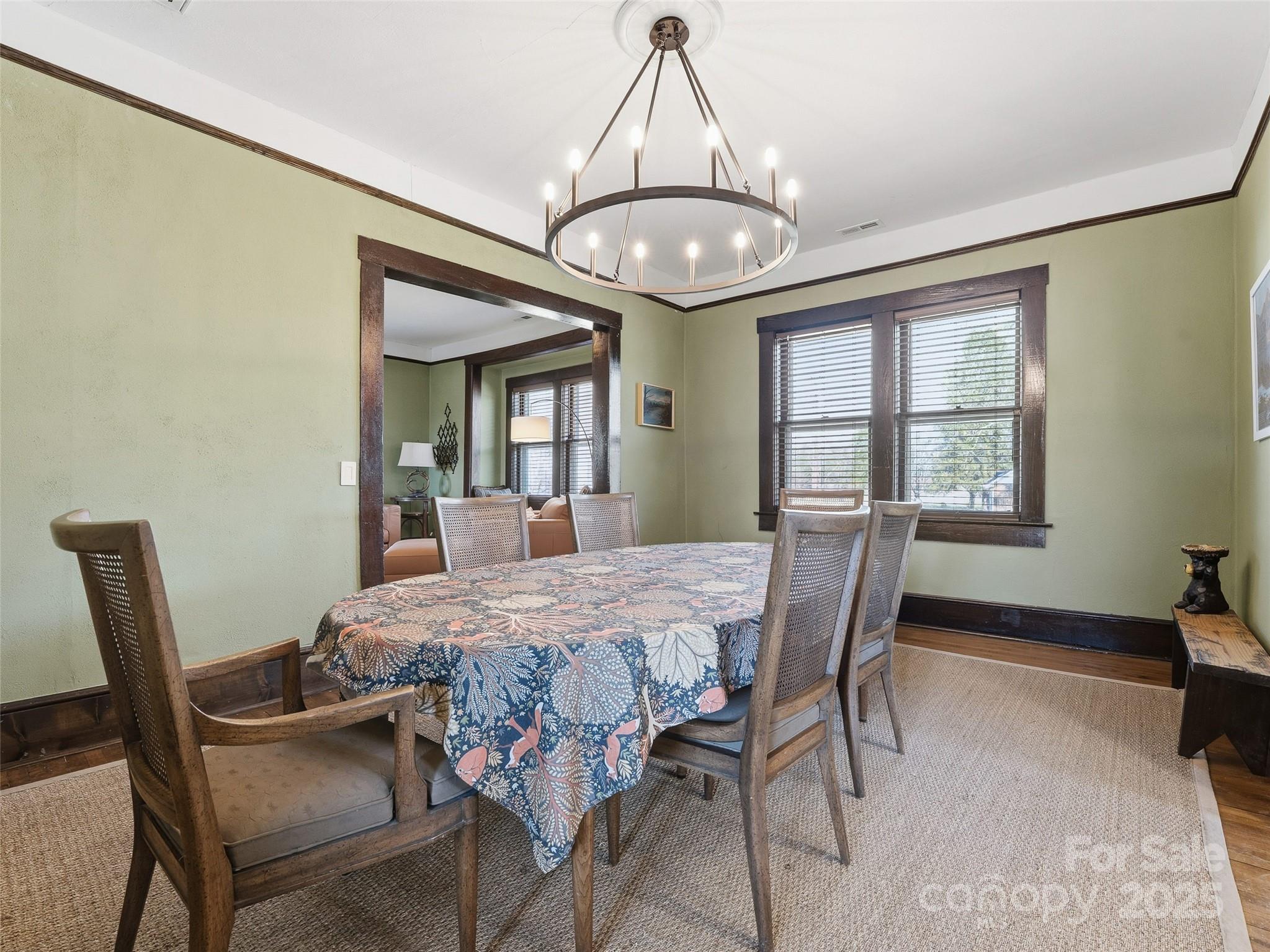 12 Sal's Lane Brevard, NC 28712 - Photo 14 of 39 a dining room with furniture a chandelier and wooden floor