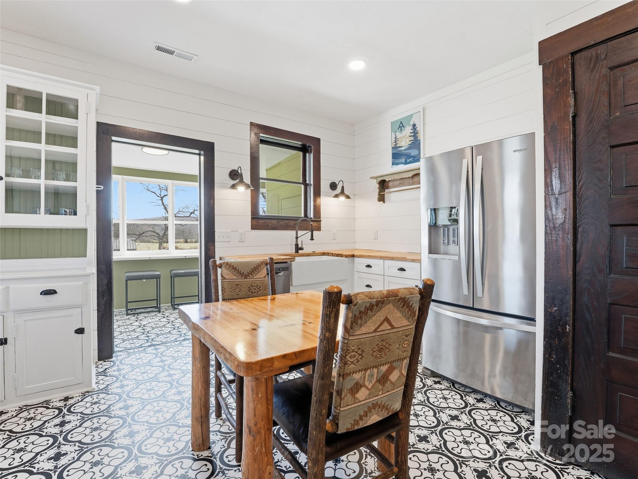 12 Sal's Lane Brevard, NC 28712 - Photo 24 of 39 a kitchen with granite countertop a refrigerator and a stove top oven