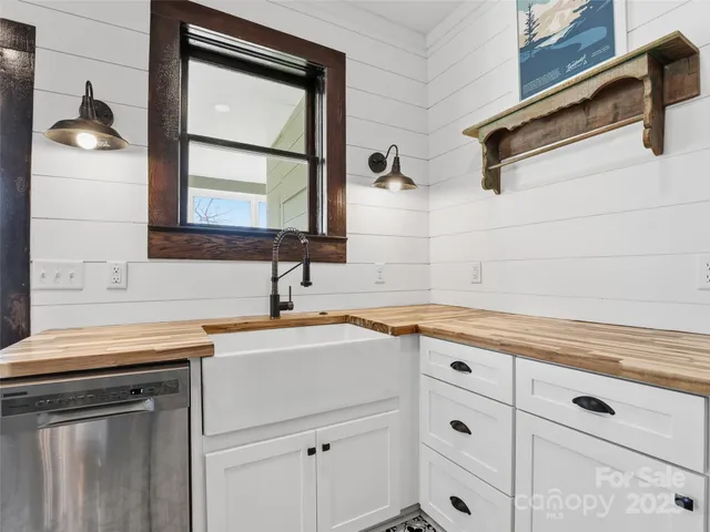 a kitchen with a sink and cabinets