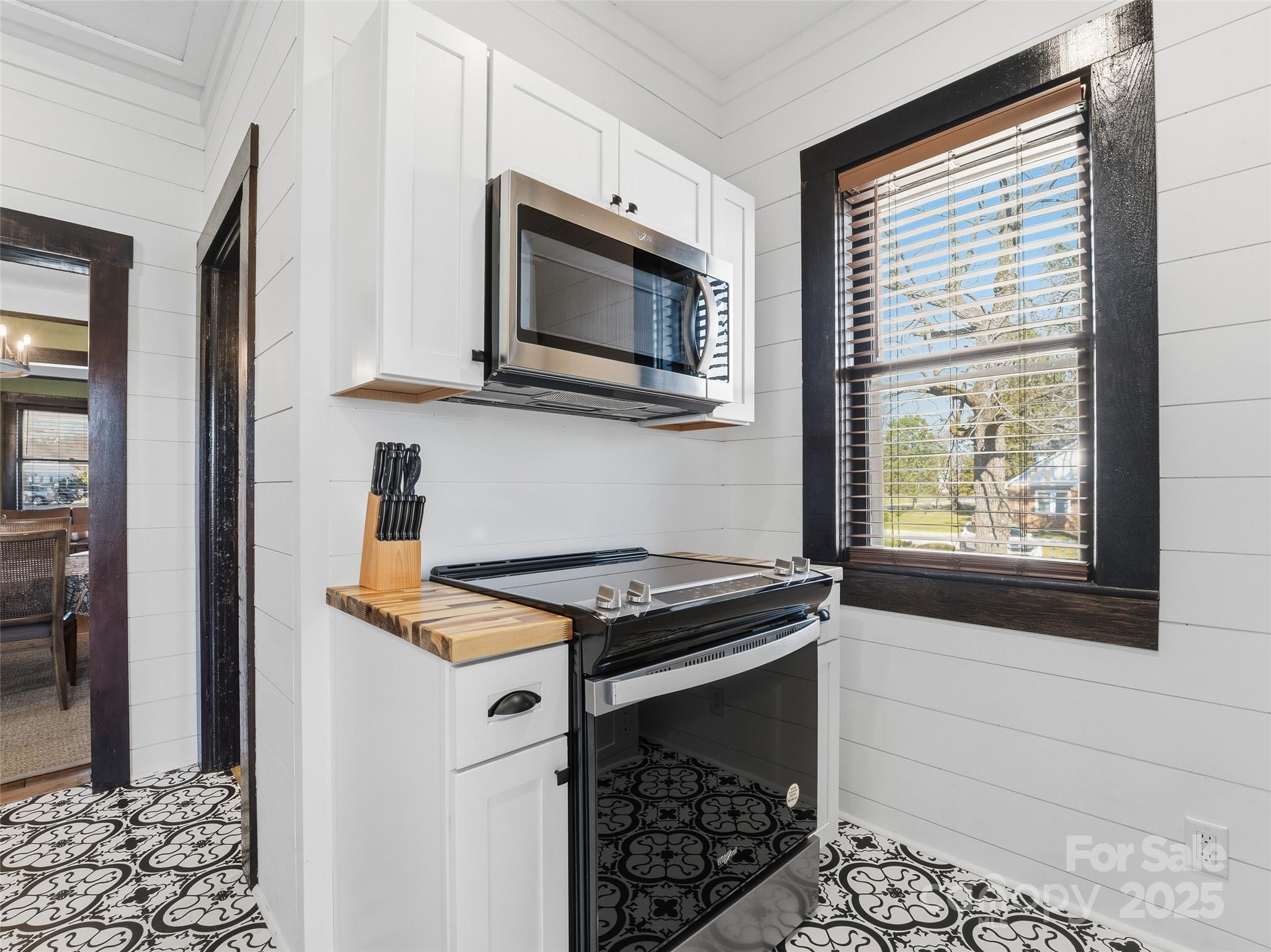 12 Sal's Lane Brevard, NC 28712 - Photo 29 of 39 a kitchen with stainless steel appliances granite countertop a stove microwave and sink