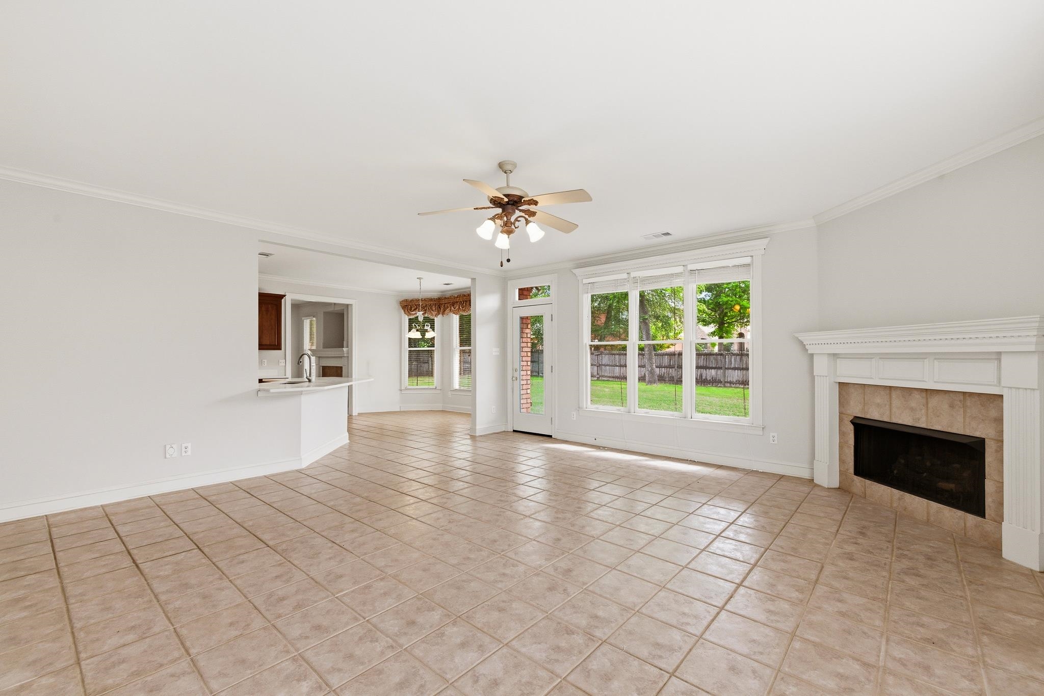 1348 Colbert Cove Collierville, TN 38017 - Photo 11 of 34 a view of an empty room with a fireplace and a window