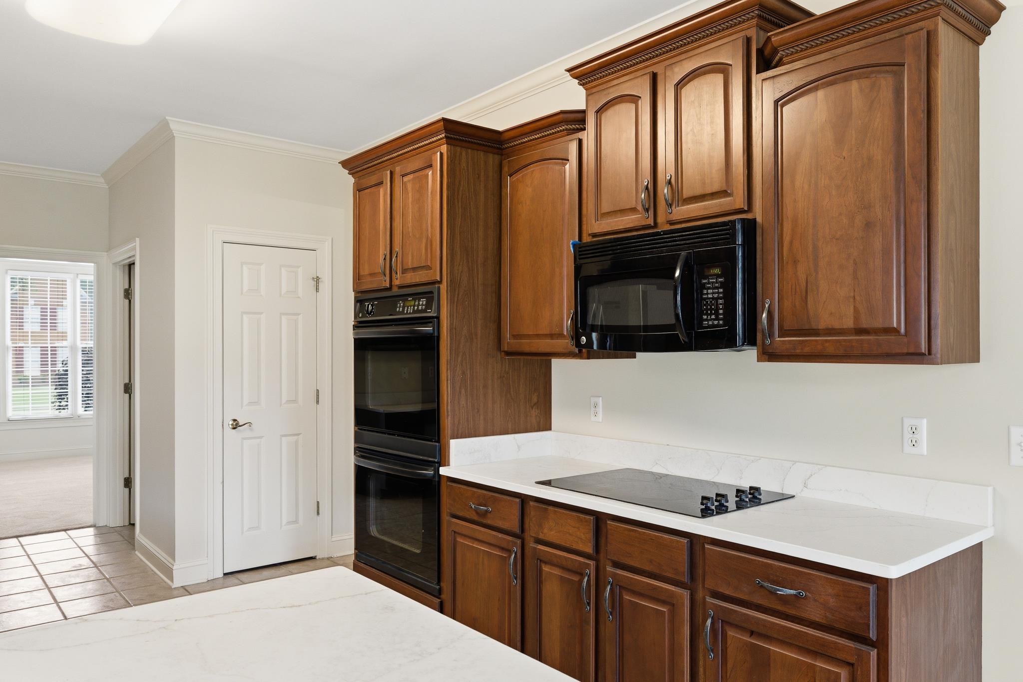 1348 Colbert Cove Collierville, TN 38017 - Photo 13 of 34 a kitchen with stainless steel appliances granite countertop a refrigerator and a stove top oven