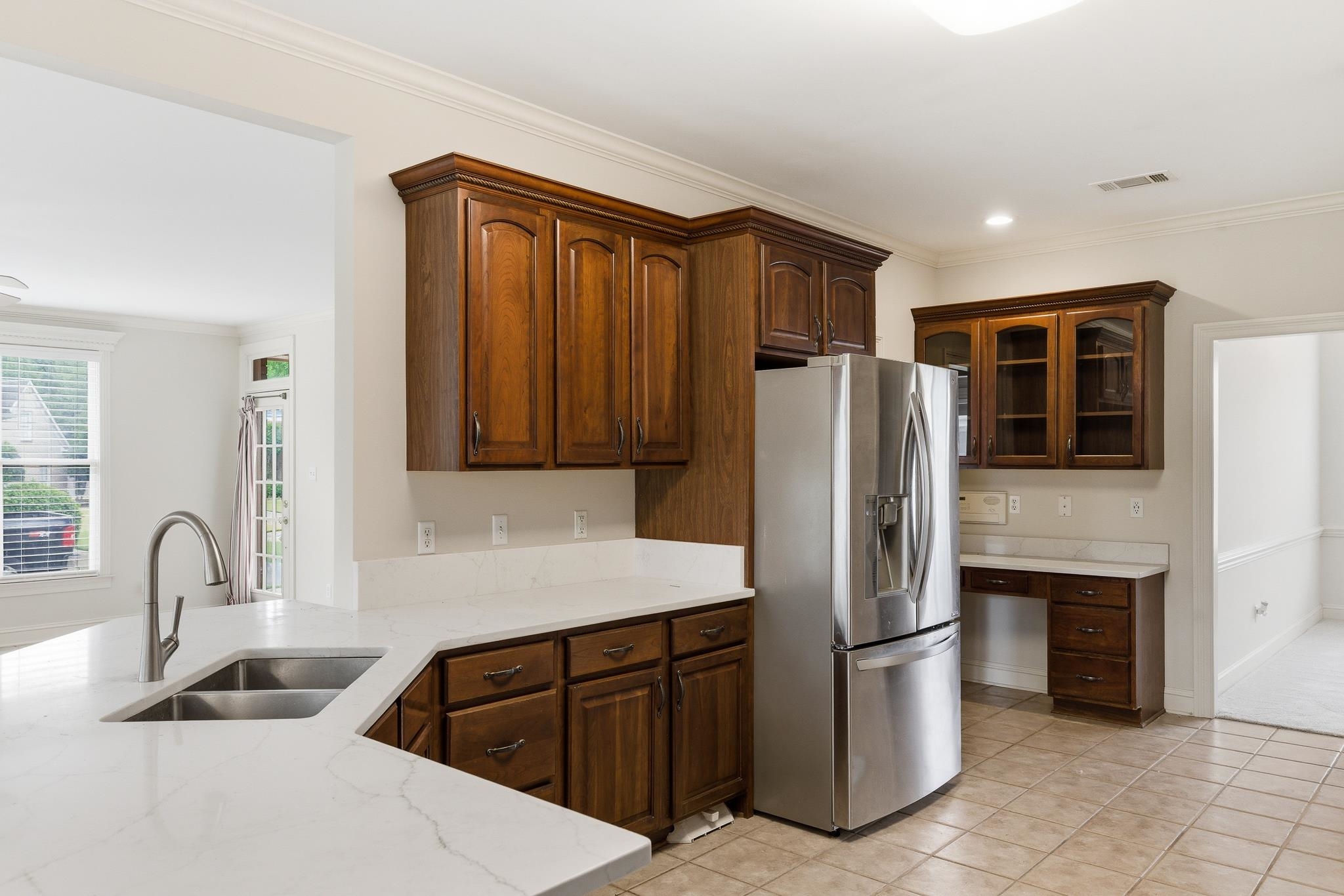 1348 Colbert Cove Collierville, TN 38017 - Photo 14 of 34 a kitchen with stainless steel appliances granite countertop a refrigerator and a sink