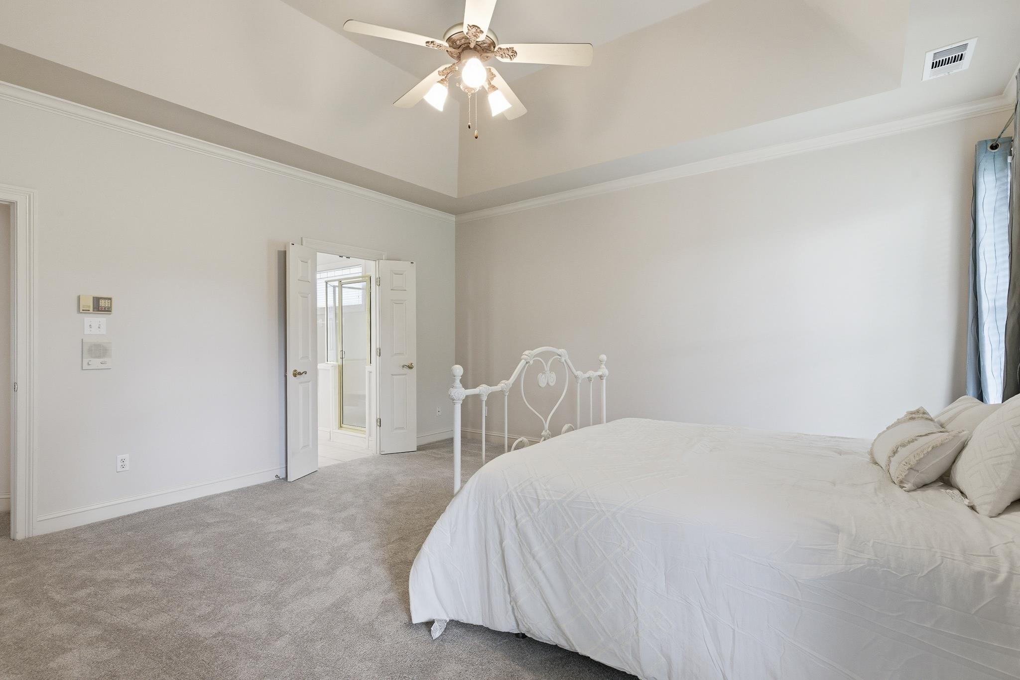 1348 Colbert Cove Collierville, TN 38017 - Photo 17 of 34 a bedroom with a bed and a chandelier